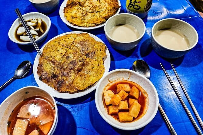 Busan: Food Crawl with Fish Market, Soju Tents & Local Snacks - Stop 1: Bupyeong Kkangtong Market, noodles, beer, and post-war roots