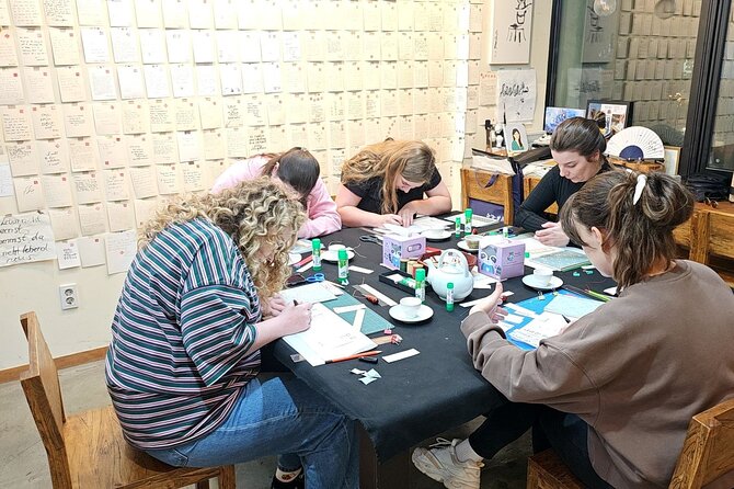 Create a Handmade Traditional Korean Notebook in Insadong - The traditional Korean binding step: holes, needle, and tight stitching