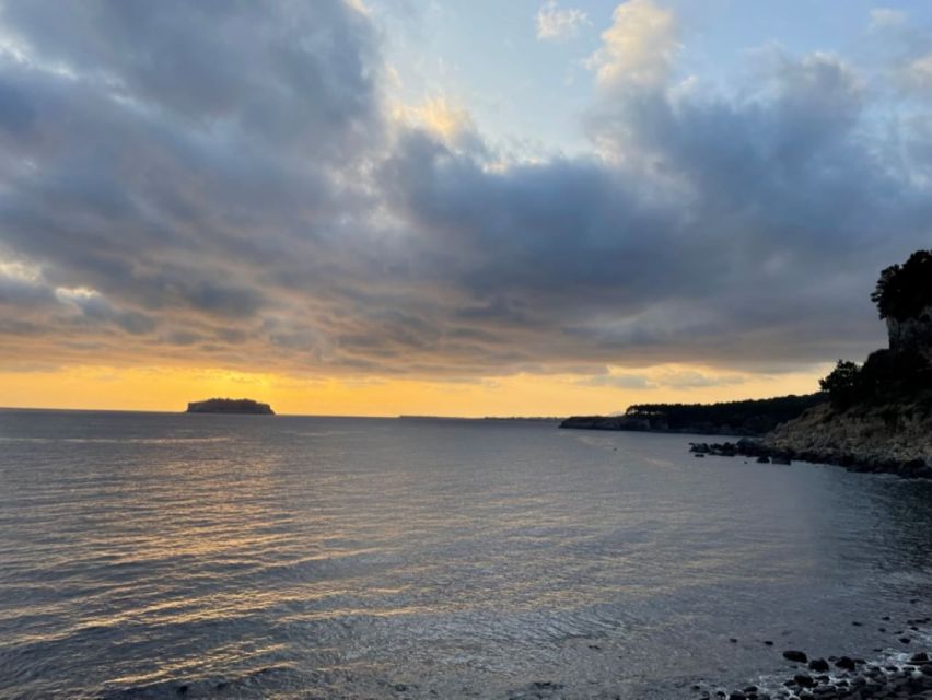 Jeju: Seogwipo City Walking Tours with Sunset - Saeyeongyo Bridge sunsets: the city landmark with a built-in photo plan