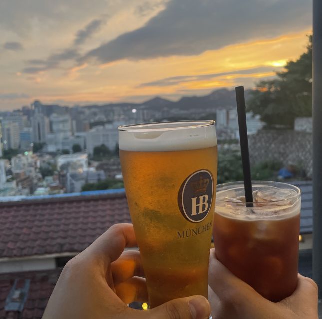 Seoul: Guided City Wall Sunset Hike with Korean Dinner - The café terrace break: your one included drink with a skyline payoff