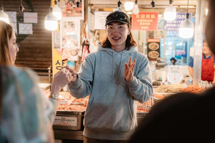 Seoul: Night Market Food Tour with Local Guide - Gwangjang Market at night: crowds become your shortcut